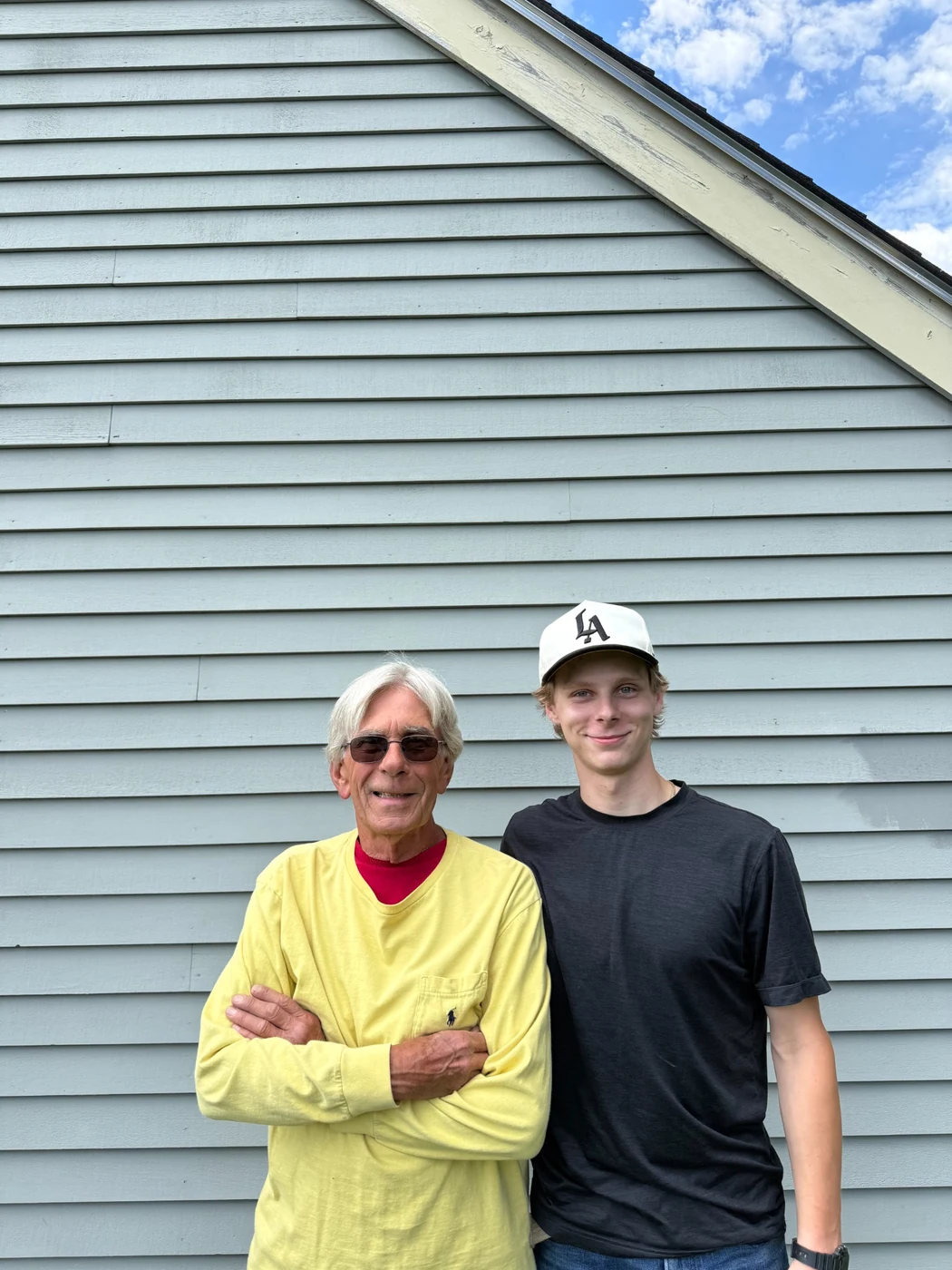 Grandfather and grandson representing family-owned Milestone Fence